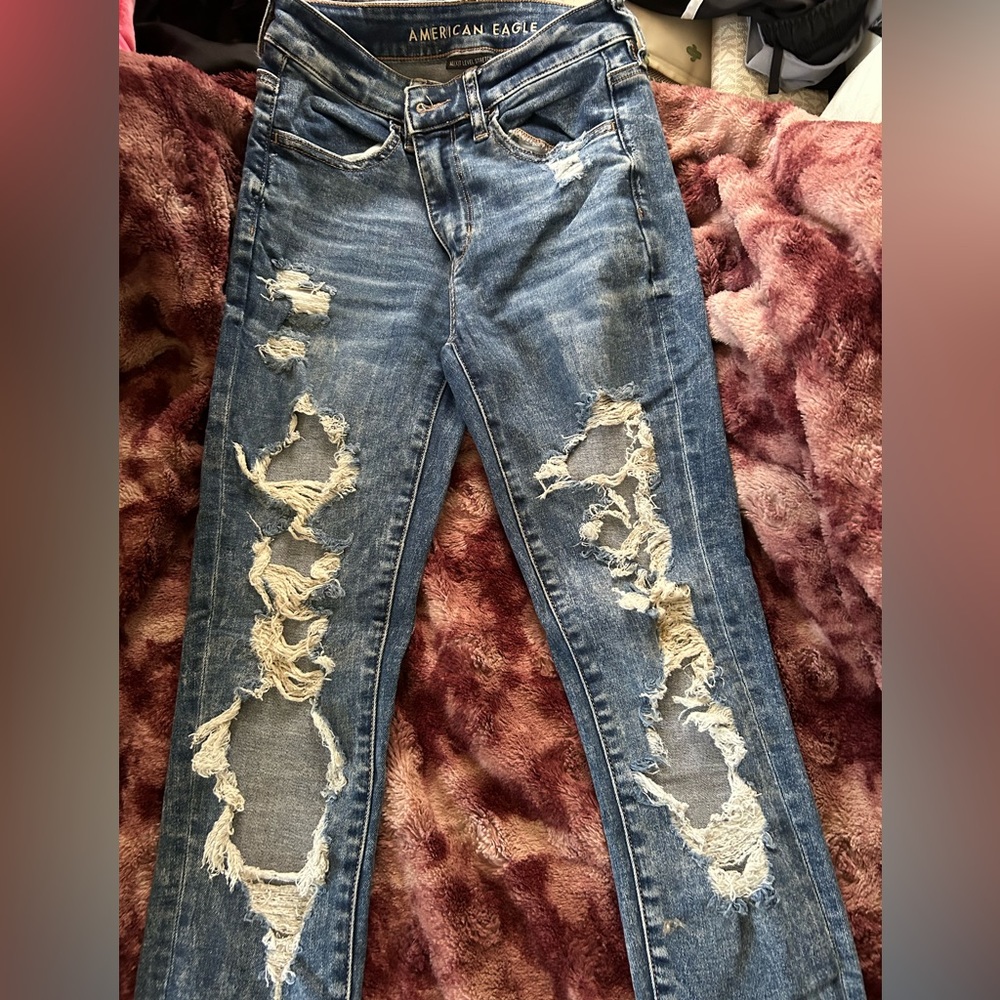 very ripped, blue american eagle jeans